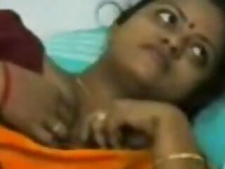 Indian MILF pleases her customer upstairs while streaming on webcam, showcasing her skills in front of the camera.